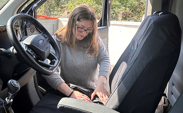 Person measuring van seat covers